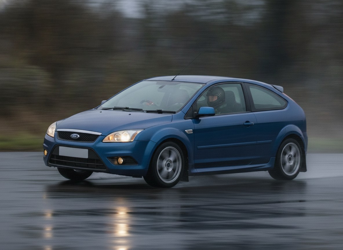 Blue Ford Focus MK2 ST225 being driven hard through a corner on a wet track, driver in a plain black helmet