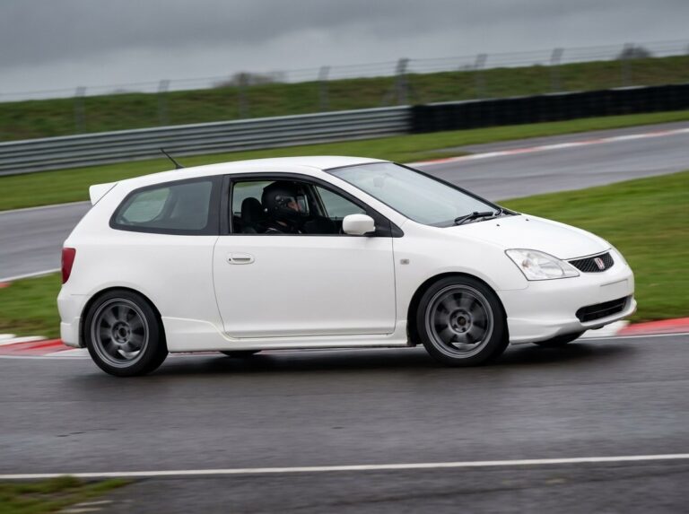 White Honda Civic Type R on a British race circuit