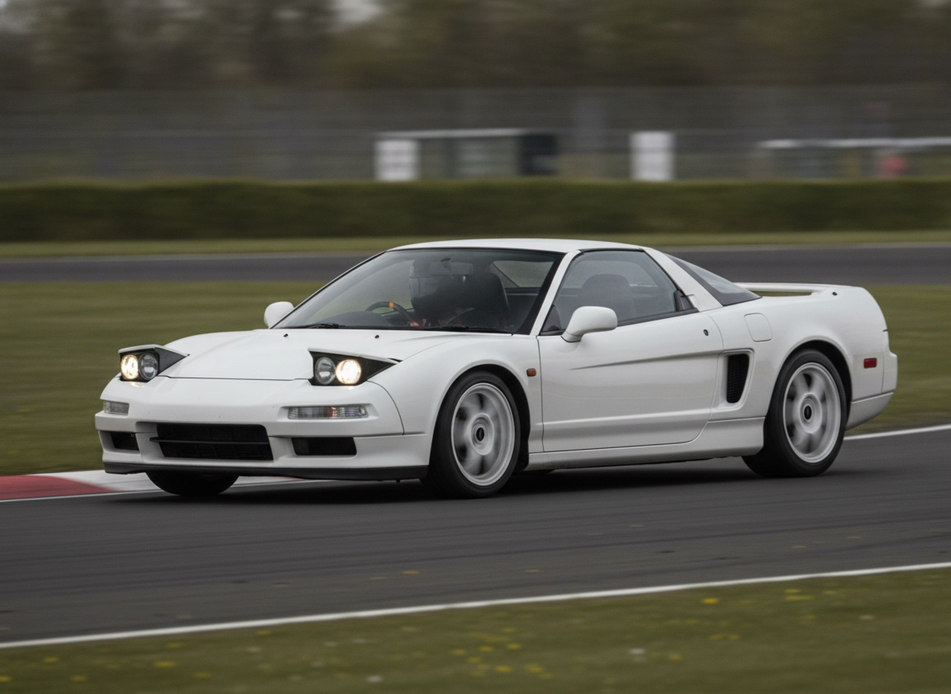 White Honda NSX on a race circuit, driver in a plain black helmet, big brake kit guide