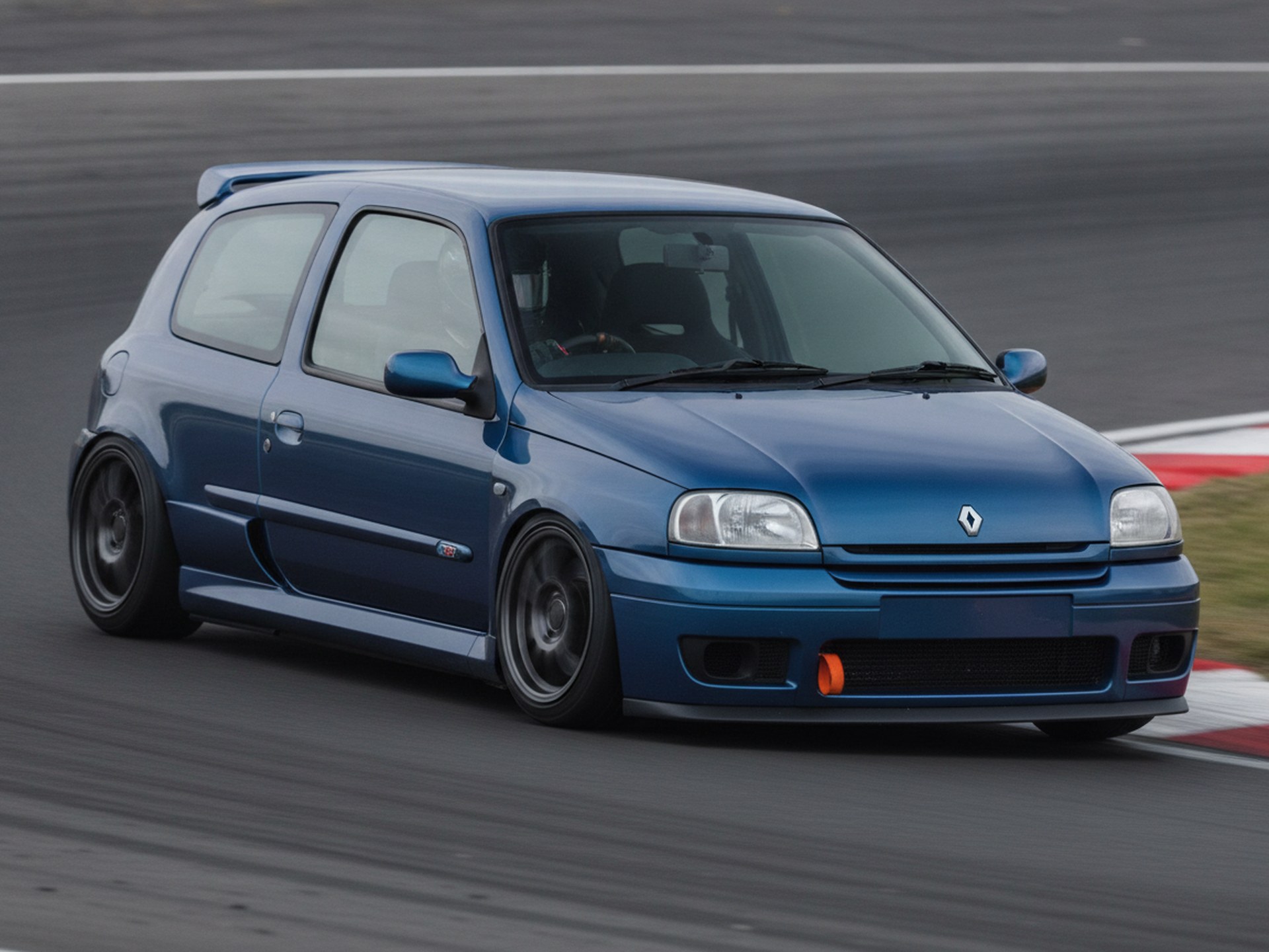 Blue Renault Clio MK1 driven hard through a corner on a rally stage, driver in a plain black helmet